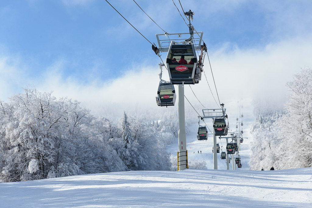 Stratton Mountain gondolas rising above snow-covered trees